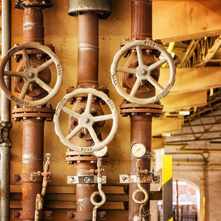 Heavily rusted and corroded pipes and valves — the 'before' of a renovation job